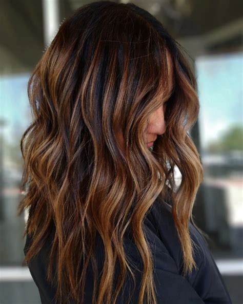20 Chic Caramel Highlights on Black Hair Ideas for 2024.